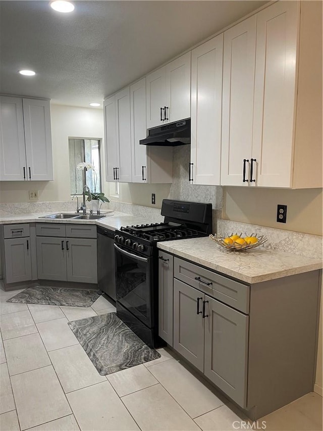 13842 Olive St, Baldwin Park, CA 91706 - kitchen with black range with gas cooktop, under cabinet range hood, stainless steel dishwasher, light countertops, and recessed lighting