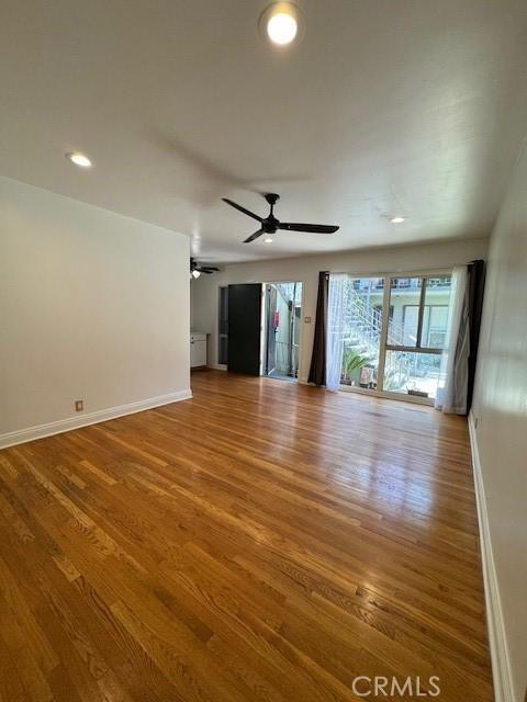 438 Cedar Ave Unit 6, Long Beach, CA 90802 - unfurnished living room with wood finished floors, ceiling fan, and recessed lighting