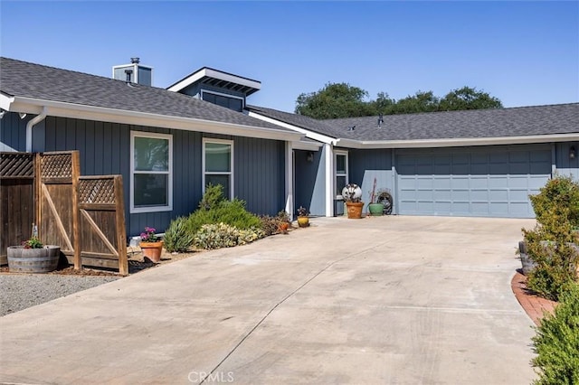 5175 White Tail Pl, Paso Robles, CA 93446 - view of front of home with an attached garage, concrete driveway, a chimney, and a shingled roof