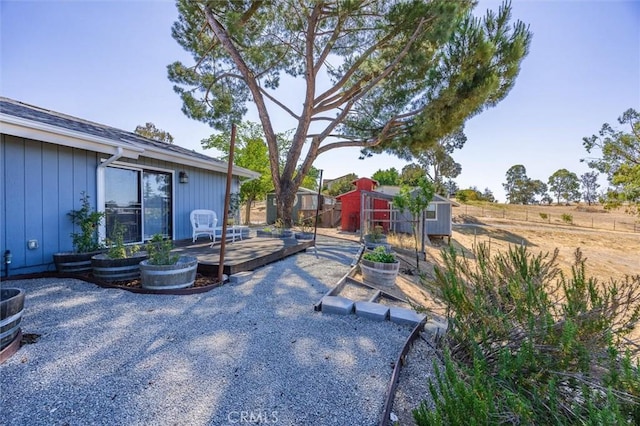 5175 White Tail Pl, Paso Robles, CA 93446 - view of yard featuring a storage unit, a vegetable garden, and a patio area