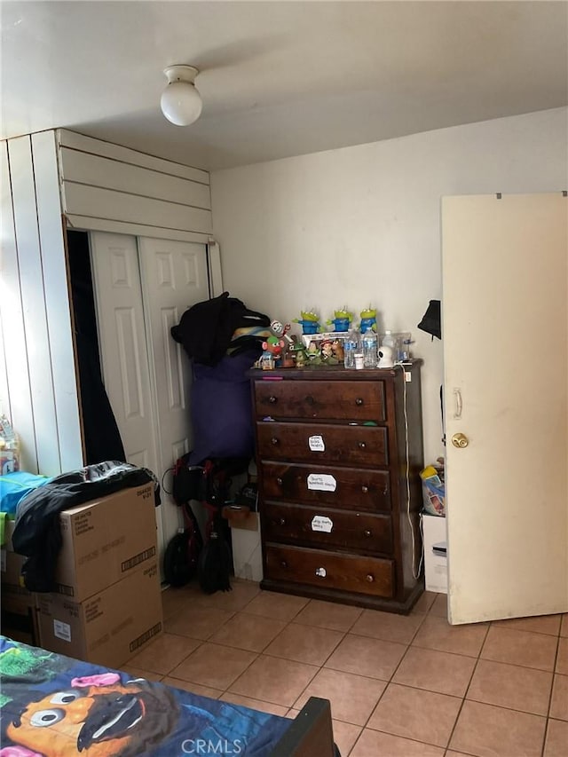 4465 Lovett St, Commerce, CA 90040 - bedroom featuring light tile patterned floors and a closet