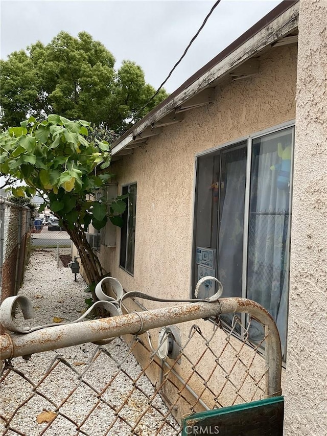 4465 Lovett St, Commerce, CA 90040 - view of side of property featuring stucco siding
