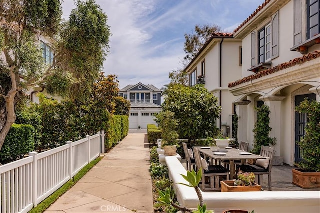 104 Via Lorca, Newport Beach, CA 92663 - view of home's community with outdoor dining area and a patio