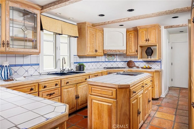 104 Via Lorca, Newport Beach, CA 92663 - kitchen with tile countertops, decorative backsplash, a center island, and cooktop