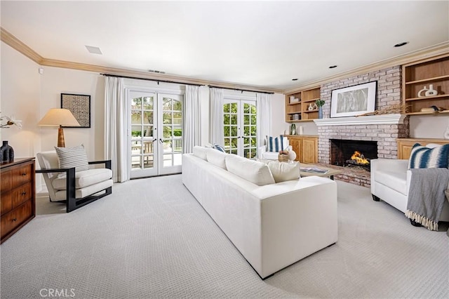 104 Via Lorca, Newport Beach, CA 92663 - living area featuring ornamental molding, french doors, light colored carpet, and a fireplace