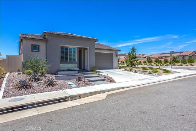 1563 Sunswept Way, Beaumont, CA 92223 - view of front of property with a garage, stucco siding, driveway, and a tile roof