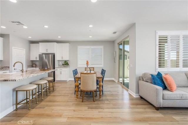 1563 Sunswept Way, Beaumont, CA 92223 - dining room featuring light wood-type flooring and recessed lighting