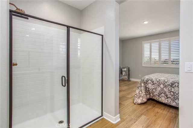 1563 Sunswept Way, Beaumont, CA 92223 - full bathroom with wood finished floors, a shower stall, ensuite bathroom, and recessed lighting