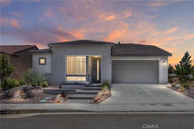 1563 Sunswept Way, Beaumont, CA 92223 - view of front of home with a garage, concrete driveway, stucco siding, and a tile roof