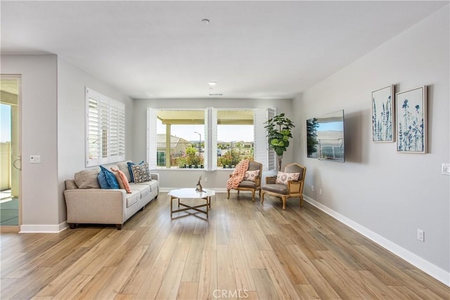 1563 Sunswept Way, Beaumont, CA 92223 - living area featuring light wood finished floors and baseboards