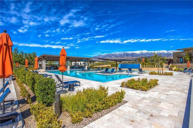 1563 Sunswept Way, Beaumont, CA 92223 - community pool with a mountain view and a patio