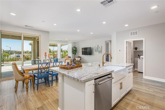 1563 Sunswept Way, Beaumont, CA 92223 - kitchen with dishwasher, white cabinetry, light wood-style floors, recessed lighting, and light stone countertops