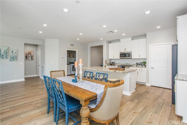 1563 Sunswept Way, Beaumont, CA 92223 - dining room with recessed lighting and light wood-style floors