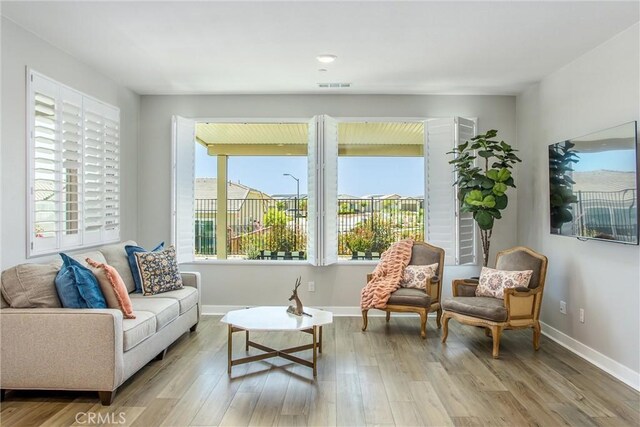 1563 Sunswept Way, Beaumont, CA 92223 - living room featuring wood finished floors and baseboards