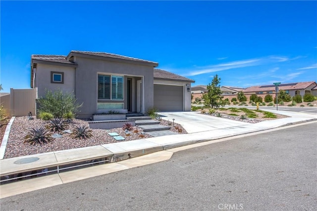 1563 Sunswept Way, Beaumont, CA 92223 - view of front of home with a garage, stucco siding, concrete driveway, and a tile roof