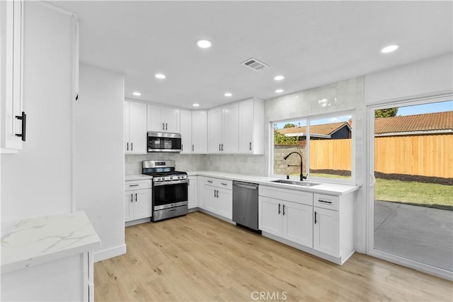 13635 Frady Ave, Chino, CA 91710 - kitchen featuring stainless steel appliances, healthy amount of natural light, light wood-type flooring, and recessed lighting