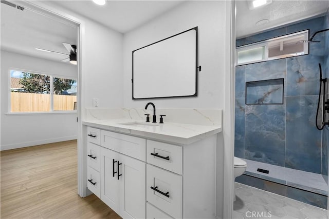13635 Frady Ave, Chino, CA 91710 - bathroom featuring vanity, a shower stall, ceiling fan, and wood finished floors