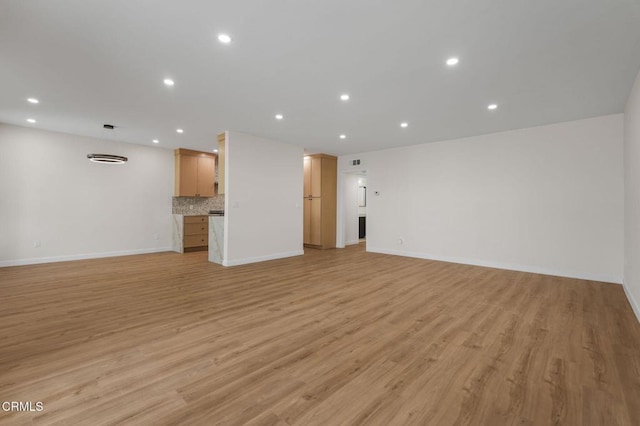 1200 W Huntington Dr Unit 21, Arcadia, CA 91007 - unfurnished living room featuring light wood finished floors and recessed lighting