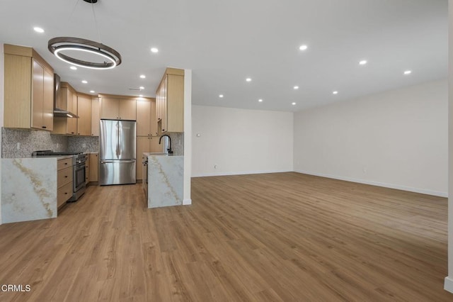 1200 W Huntington Dr Unit 21, Arcadia, CA 91007 - kitchen with appliances with stainless steel finishes, wall chimney exhaust hood, tasteful backsplash, light wood-style flooring, and open floor plan