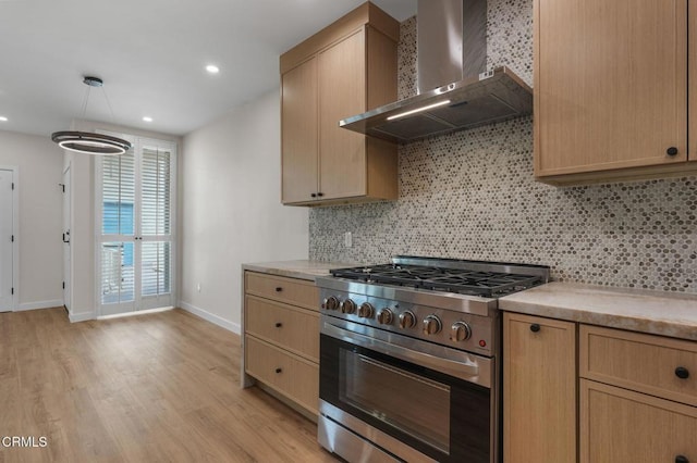 1200 W Huntington Dr Unit 21, Arcadia, CA 91007 - kitchen with gas stove, wall chimney range hood, light brown cabinetry, decorative backsplash, and light wood-style floors