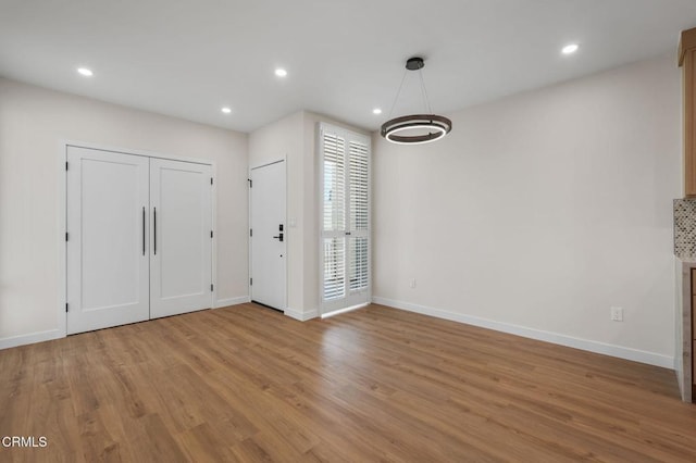 1200 W Huntington Dr Unit 21, Arcadia, CA 91007 - foyer with light wood-style flooring and recessed lighting