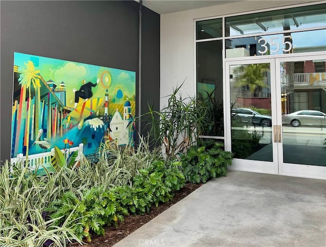 355 N Cleveland St Unit 211, Oceanside, CA 92054 - property entrance featuring french doors and stucco siding