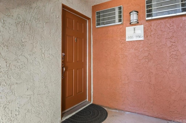 9959 Azuaga St Unit 105, San Diego, CA 92129 - view of exterior entry with stucco siding