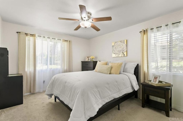 9959 Azuaga St Unit 105, San Diego, CA 92129 - bedroom with light colored carpet and ceiling fan