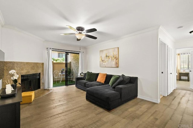 9959 Azuaga St Unit 105, San Diego, CA 92129 - living room with a ceiling fan, wood finished floors, ornamental molding, and a fireplace