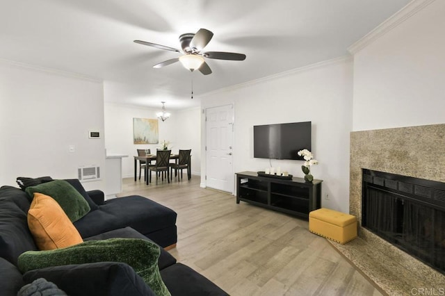 9959 Azuaga St Unit 105, San Diego, CA 92129 - living area featuring light wood-type flooring, ceiling fan, ornamental molding, a chandelier, and a fireplace
