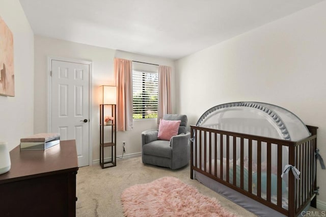 9959 Azuaga St Unit 105, San Diego, CA 92129 - carpeted bedroom featuring baseboards and a crib