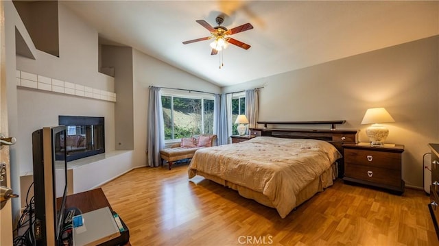25961 Brookmere Ave, Loma Linda, CA 92354 - bedroom with wood finished floors, a multi sided fireplace, ceiling fan, and high vaulted ceiling