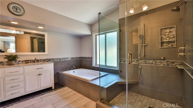 25961 Brookmere Ave, Loma Linda, CA 92354 - bathroom featuring vanity, a bath, a shower stall, and vaulted ceiling