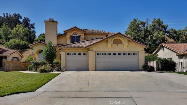 25961 Brookmere Ave, Loma Linda, CA 92354 - mediterranean / spanish house featuring a chimney, driveway, stucco siding, a garage, and a tiled roof