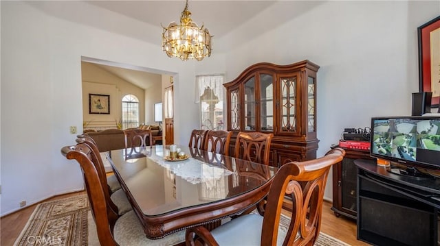 25961 Brookmere Ave, Loma Linda, CA 92354 - dining space featuring a chandelier, light wood finished floors, and vaulted ceiling