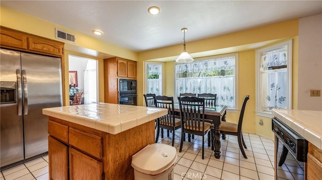25961 Brookmere Ave, Loma Linda, CA 92354 - kitchen featuring black appliances, tile countertops, brown cabinetry, and recessed lighting