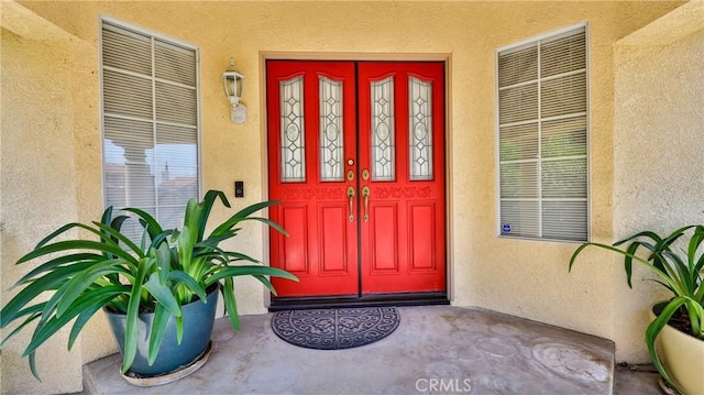 25961 Brookmere Ave, Loma Linda, CA 92354 - view of exterior entry featuring stucco siding and covered porch