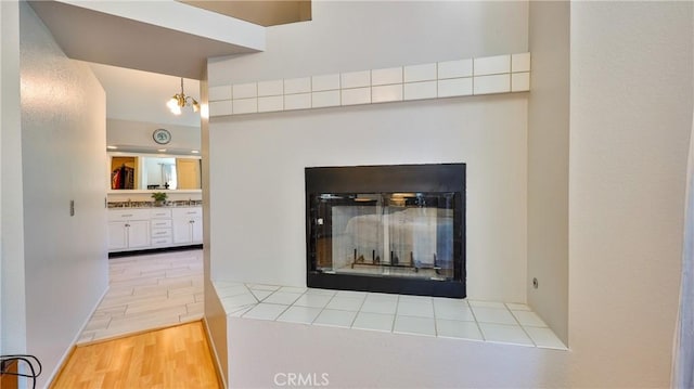 25961 Brookmere Ave, Loma Linda, CA 92354 - detailed view of a fireplace with flush hearth and wood finished floors