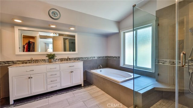 25961 Brookmere Ave, Loma Linda, CA 92354 - full bath with double vanity, a stall shower, a garden tub, lofted ceiling, and recessed lighting