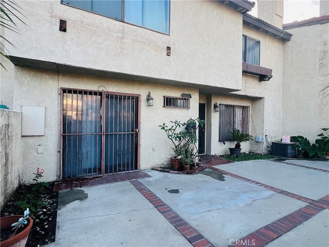 13500 Ramona Pkwy, Baldwin Park, CA 91706 - doorway to property with stucco siding and a patio