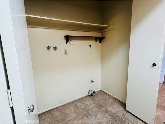 13500 Ramona Pkwy, Baldwin Park, CA 91706 - laundry room with hookup for a gas dryer, light tile patterned flooring, and hookup for an electric dryer