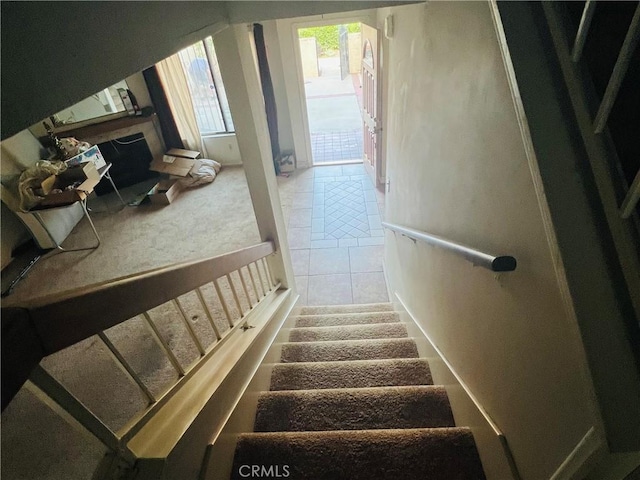 13500 Ramona Pkwy, Baldwin Park, CA 91706 - stairway with a fireplace with raised hearth and carpet floors