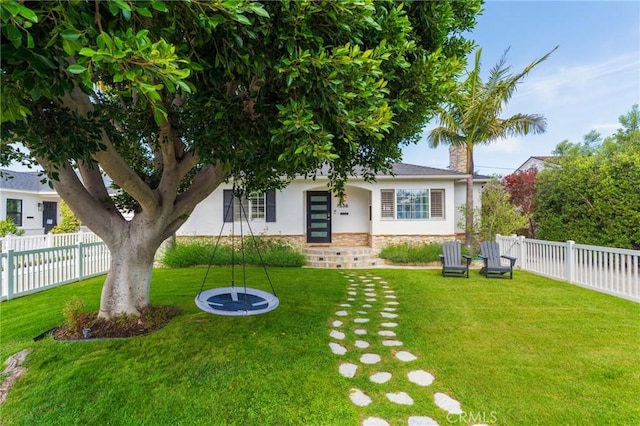 7838 Stewart Ave, Los Angeles, CA 90045 - view of front of property with stucco siding, a fenced backyard, and stone siding