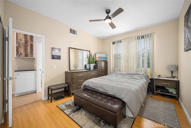 1879 Atlantic Ave Unit 15, Long Beach, CA 90806 - bedroom with light wood finished floors and ceiling fan