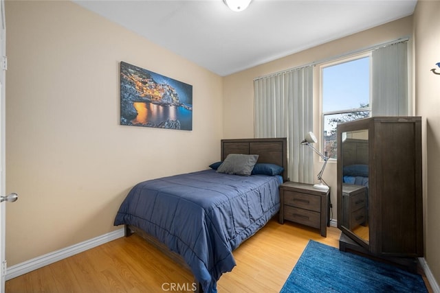 1879 Atlantic Ave Unit 15, Long Beach, CA 90806 - bedroom with wood finished floors and baseboards