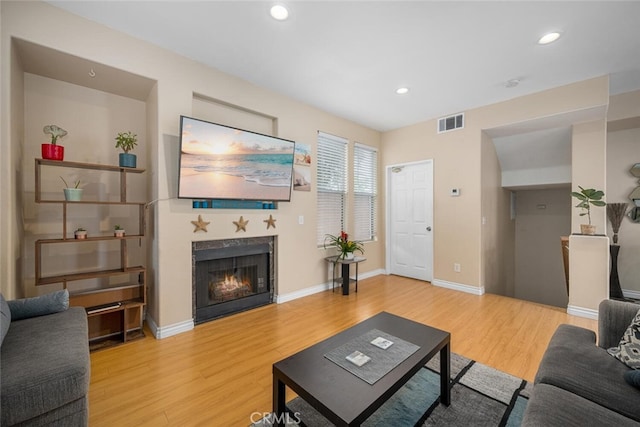 1879 Atlantic Ave Unit 15, Long Beach, CA 90806 - living room with a fireplace, light wood-type flooring, and recessed lighting