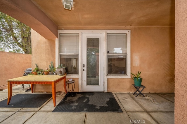 1879 Atlantic Ave Unit 15, Long Beach, CA 90806 - entrance to property with a patio area and stucco siding