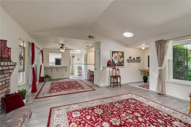 520 Wilshire Ct, Chico, CA 95973 - living room featuring wood finished floors, vaulted ceiling, and a ceiling fan