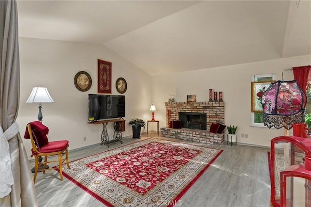 520 Wilshire Ct, Chico, CA 95973 - living area featuring vaulted ceiling, wood finished floors, and a fireplace