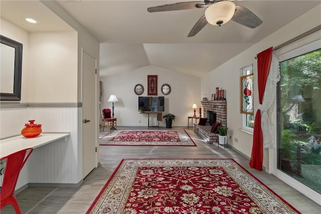 520 Wilshire Ct, Chico, CA 95973 - living room with light wood-style flooring, a ceiling fan, a fireplace, and lofted ceiling